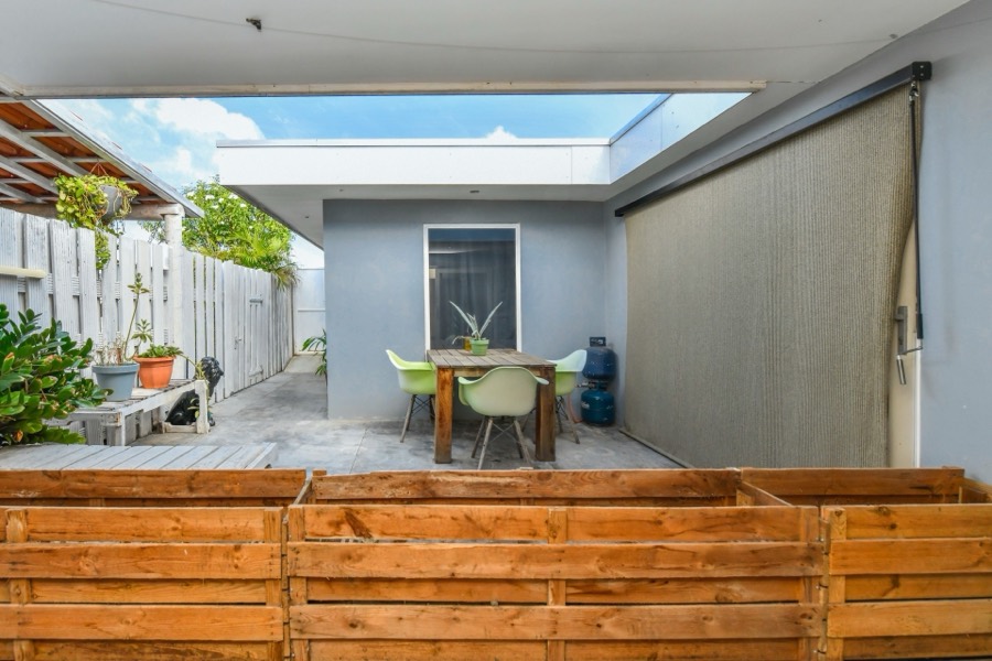 Shaded courtyard with a dining table for four