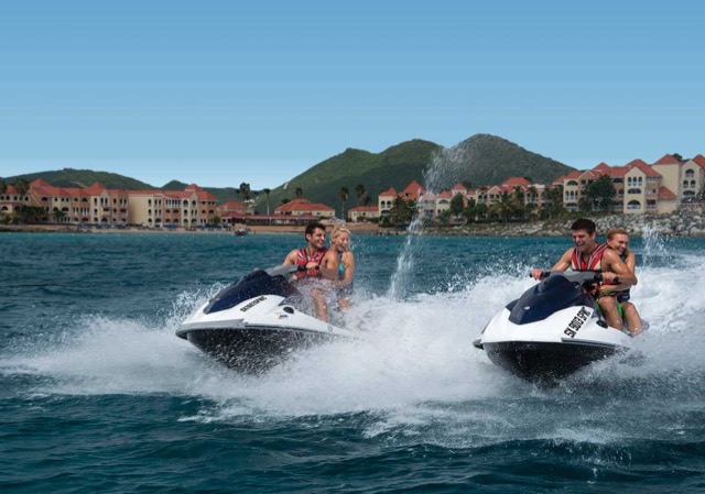 Two jet skis on the water off Divi Beach