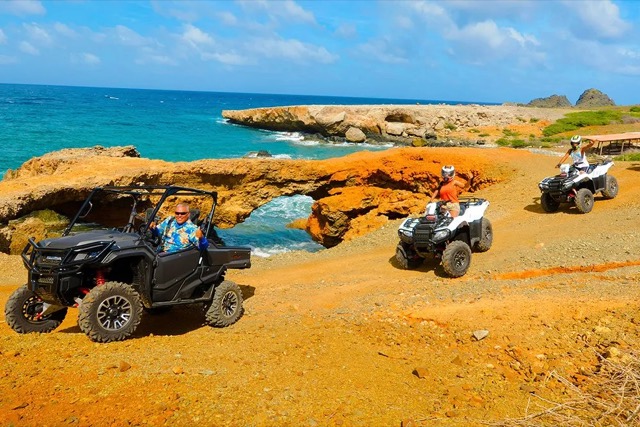 ATVs parked on a rocky coastline