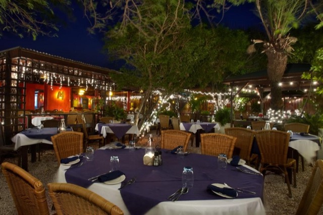 Candlelit garden tables at Madam Janette’s